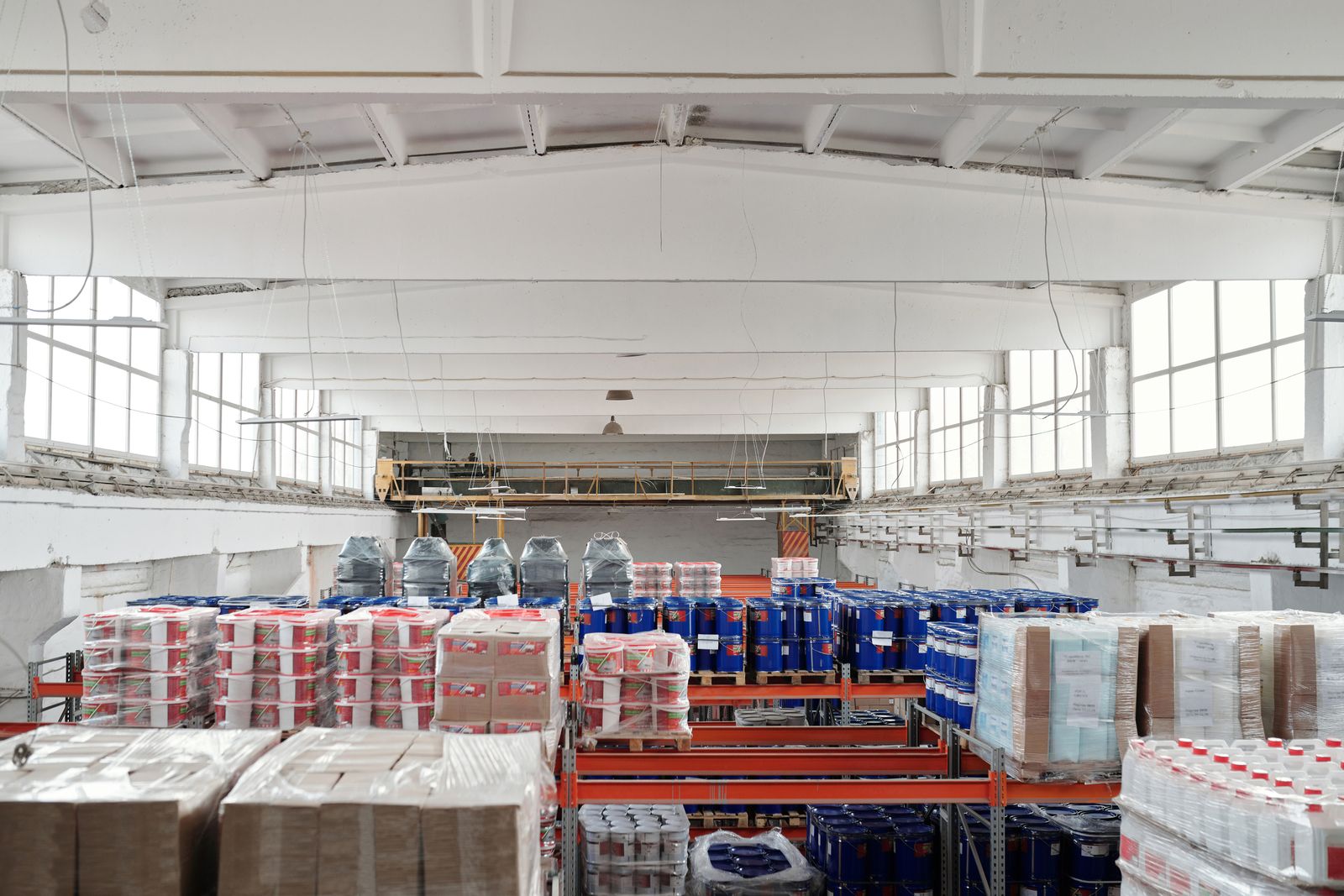 Stored drums and packed goods in a warehouse