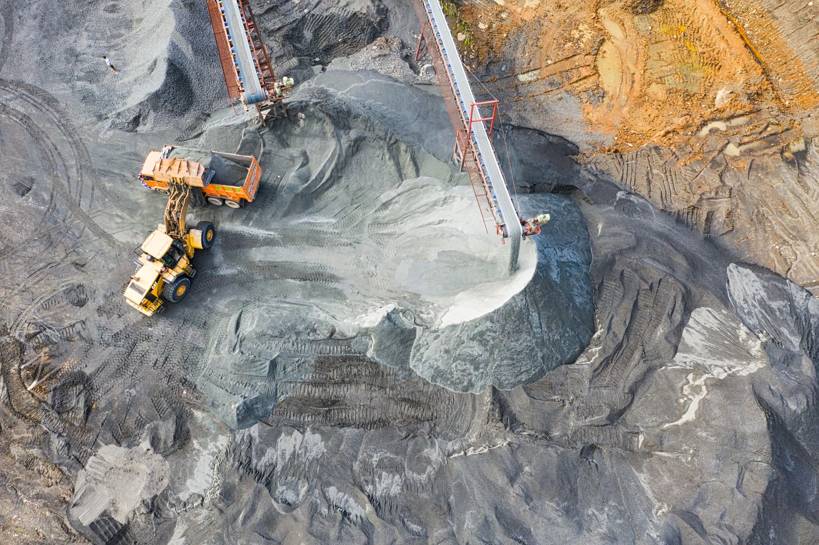 An aerial view of mineral handling and loading equipment