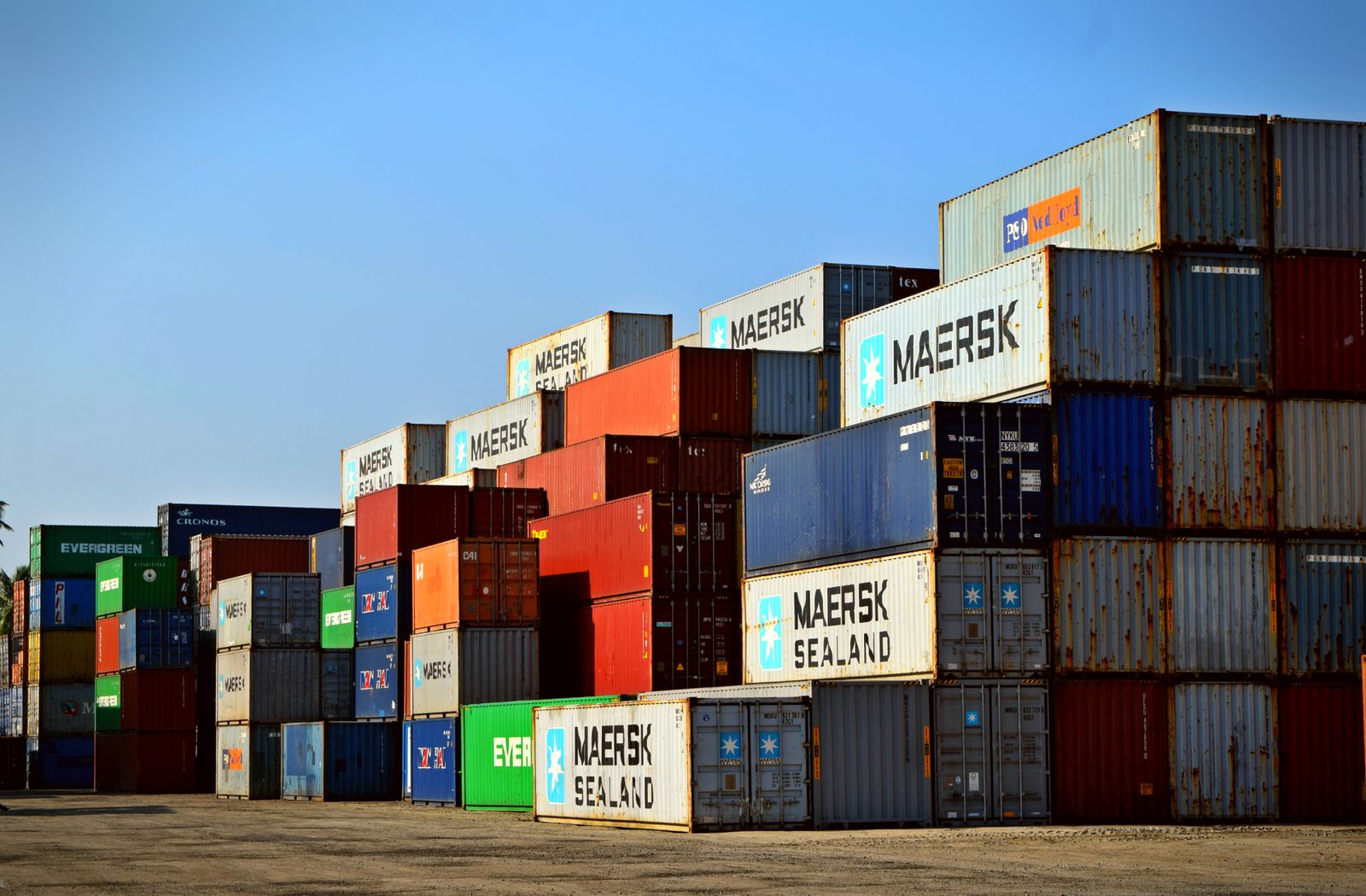 Stacked shipping containers in a yard